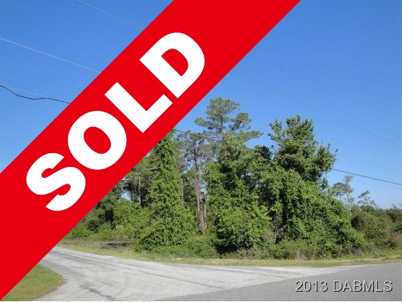 SOLD! 5.56 acre lot on paved road near everything!
