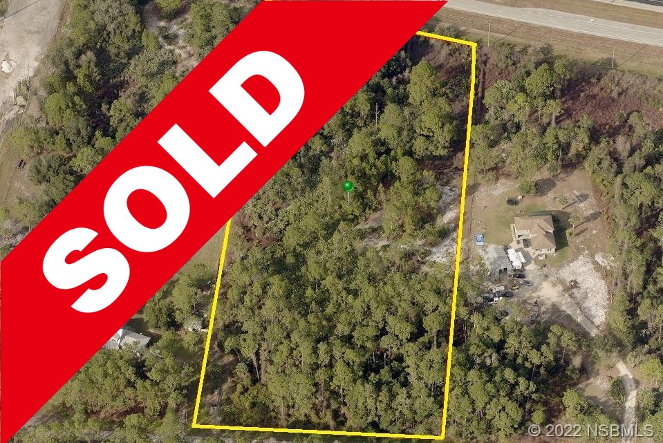 SOLD! Beautiful 5.81 acre lot in subdivision of very nice homes and paved roads!